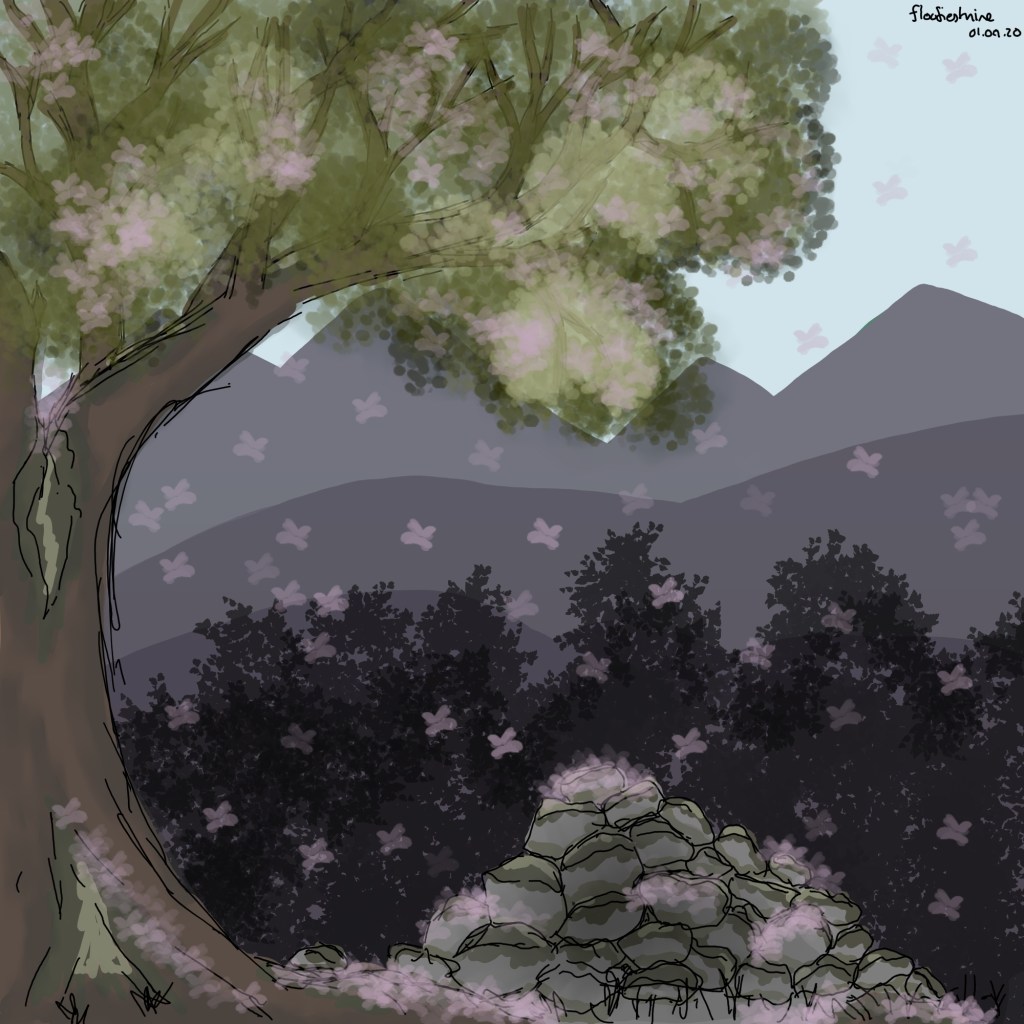 Rock cairn under blooming cherry tree